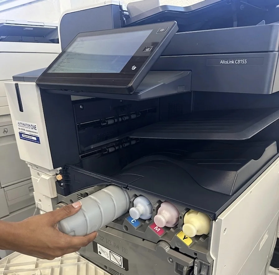 Technician replacing toner in a Xerox AltaLink C8155 at Automation One